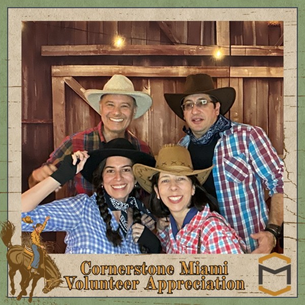 Four guests wearing cowboy hats at a western-themed party